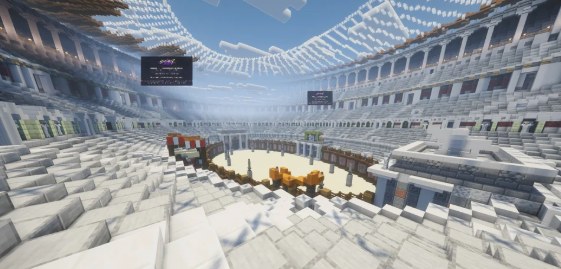 Het colosseum met witte tribunes rondom een zandvloer